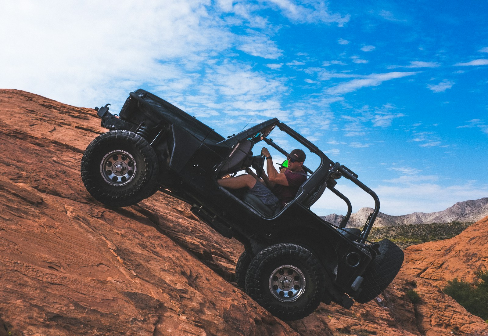 man riding a black off-road vehicle, rv, recreational vehicle